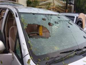 Big hail stones broke the Car front glass in Kupwara